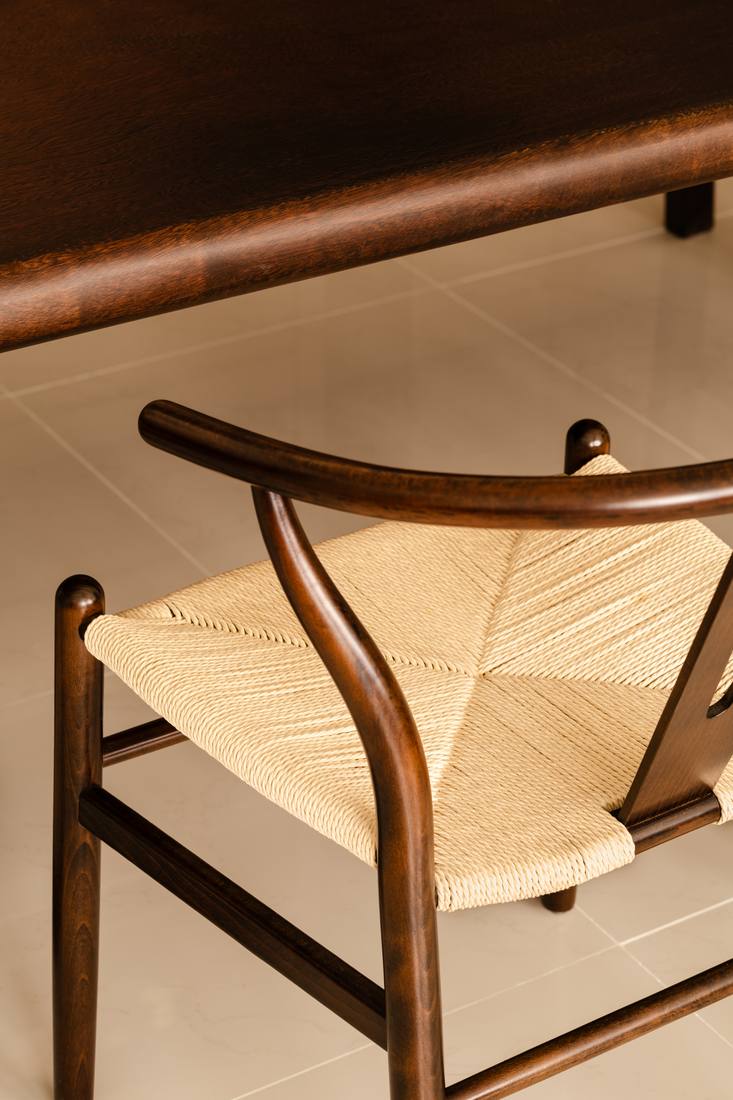A wishbone chair against the dining table