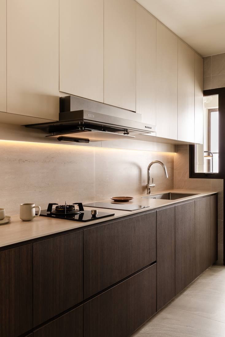 The kitchen in dark timber with a stone backsplash